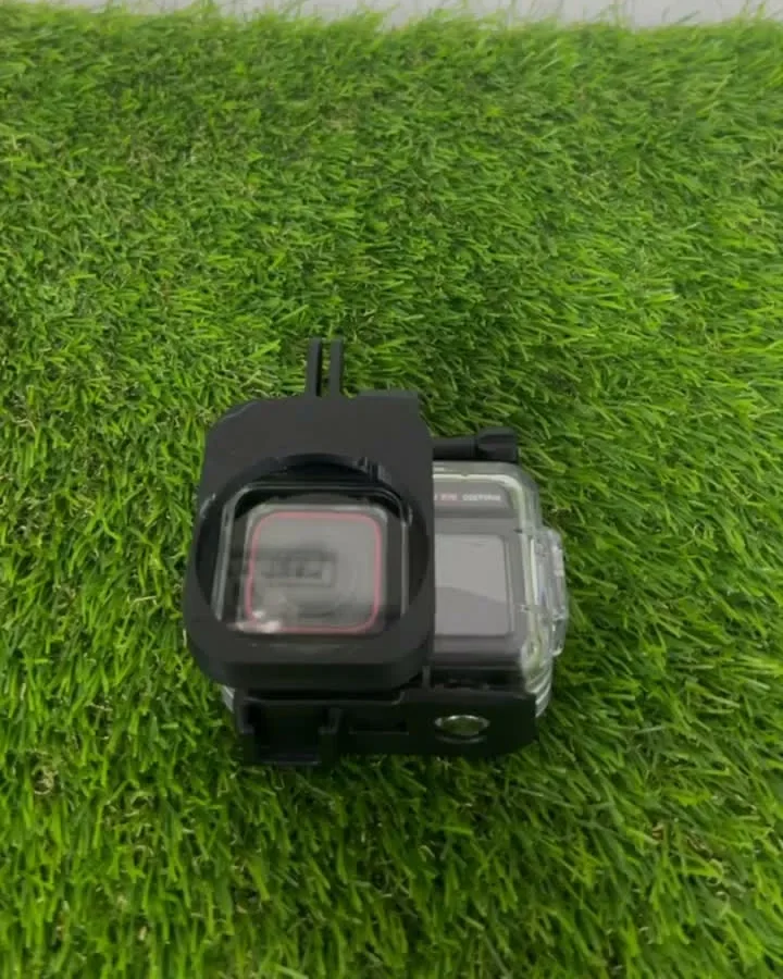 The finished black snap adapter clipped over a GoPro's waterproof housing