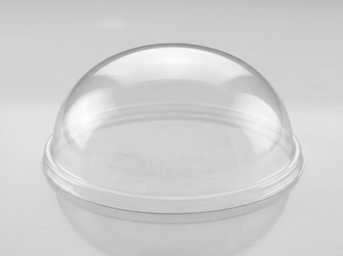 Clear vacuum-formed plastic dome shell, semi-transparent with uniform wall thickness