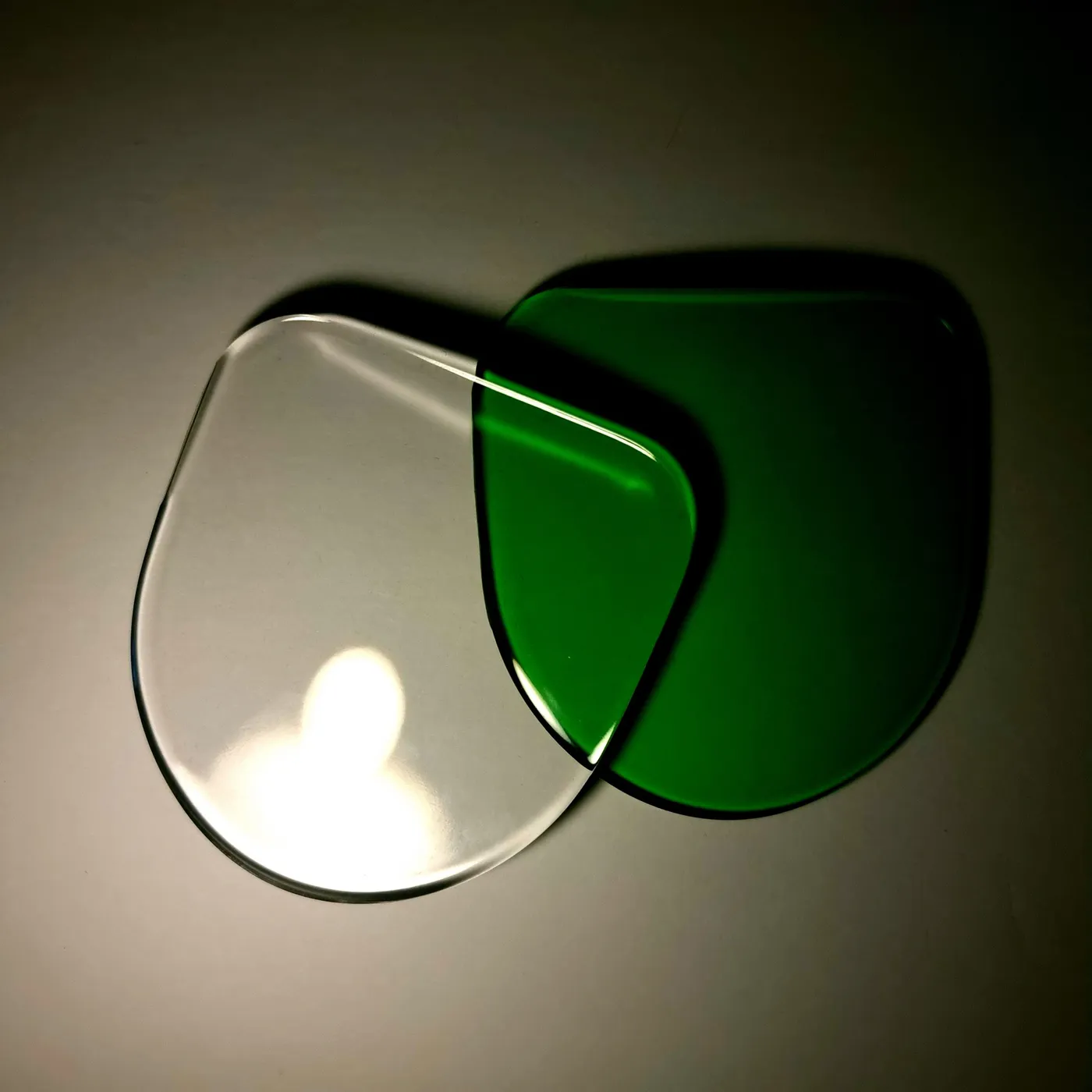 Clear and green SLA resin parts showing the smooth, translucent finish
