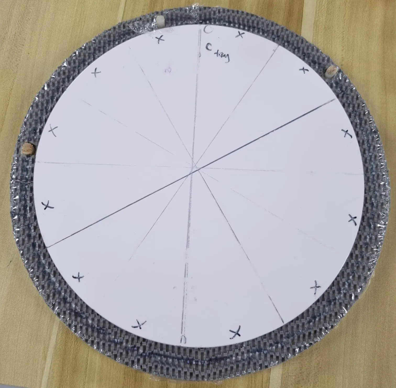The client's original holder, the sample we measured, with a white cake board marked out in 12 slices
