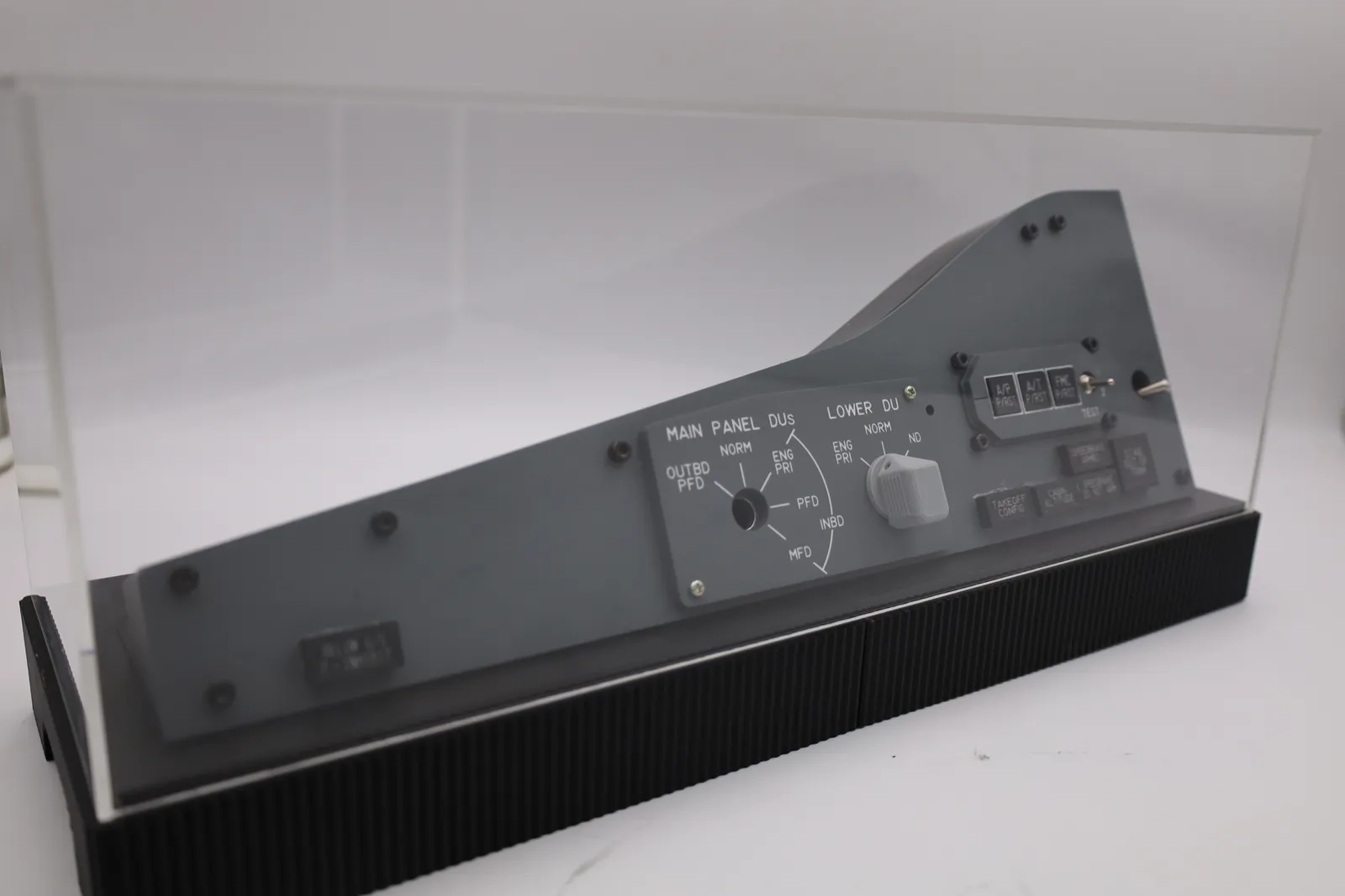 The enclosure from a low angle with the clear acrylic cover on, showing the cover sitting on the ledge around the top of the