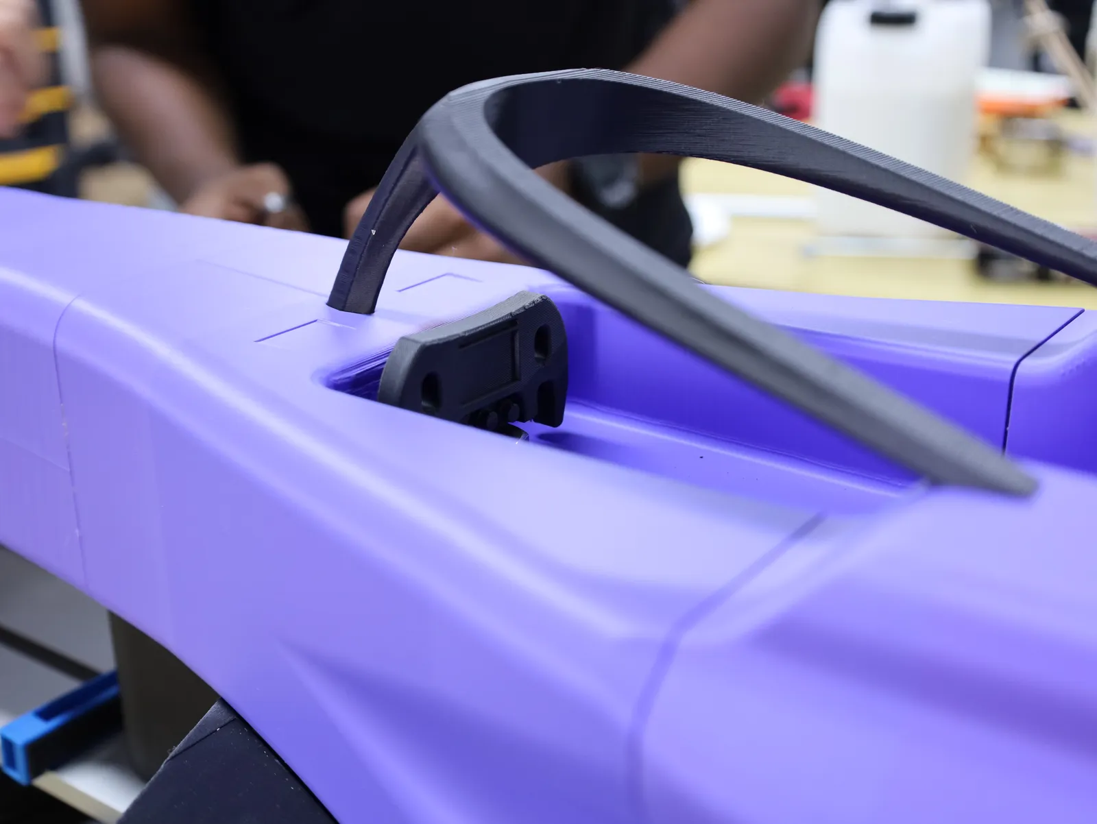 Close-up of the black halo fitted over the cockpit of the purple body
