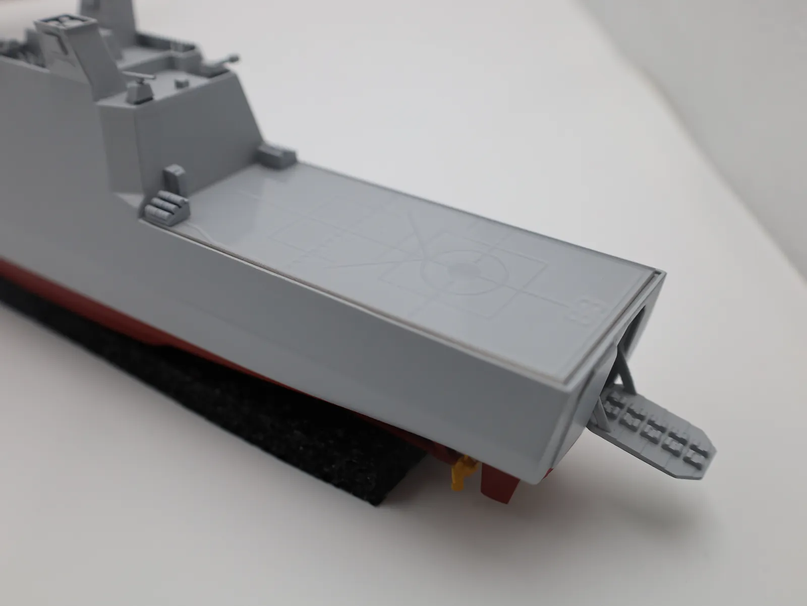 The stern from above, with markings set into the flight deck and a ramp folded down at the back