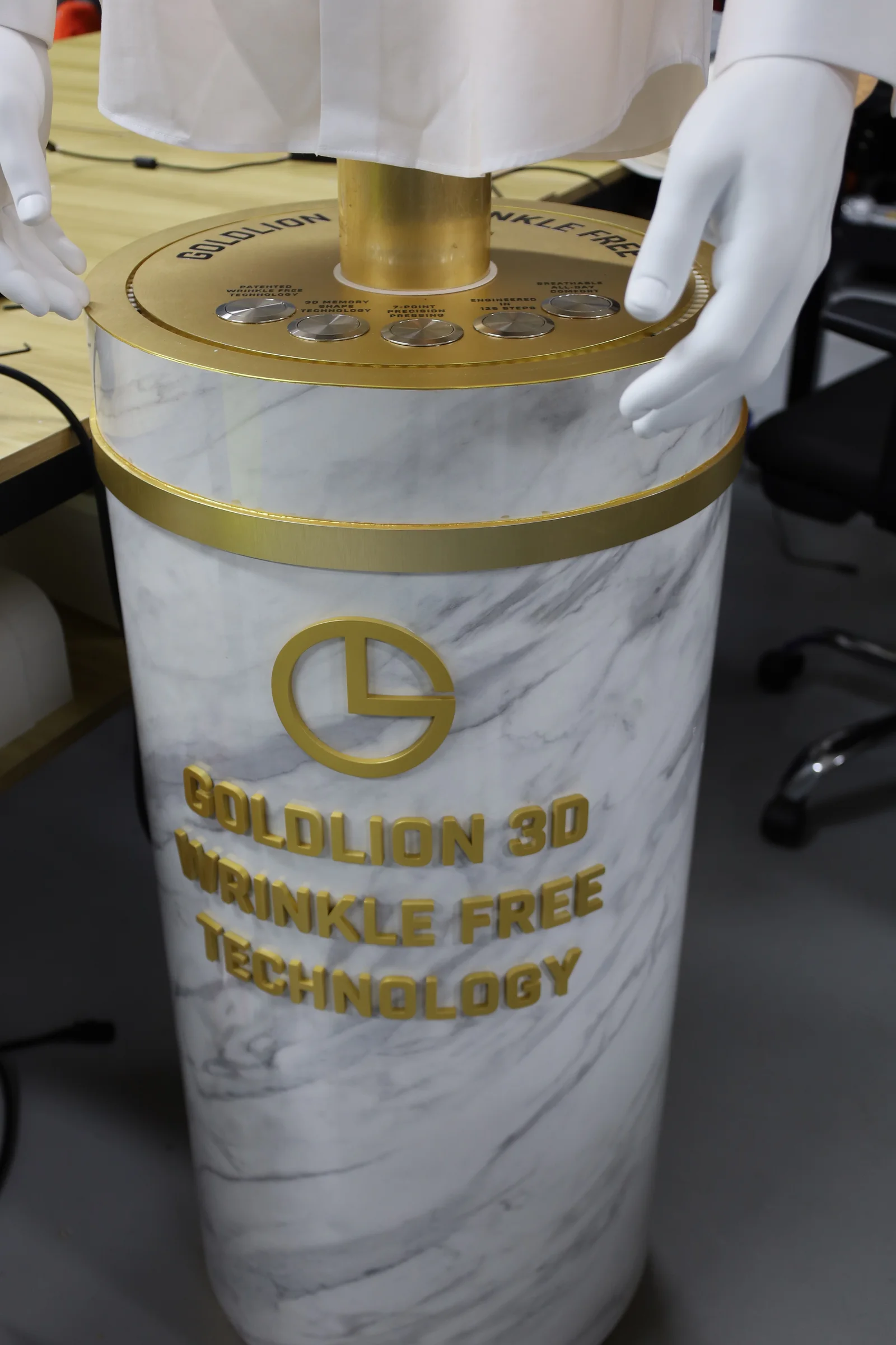 Goldlion Interactive Shirt Display — Built the plinth in custom carpentry and wrapped it in marble-look vinyl