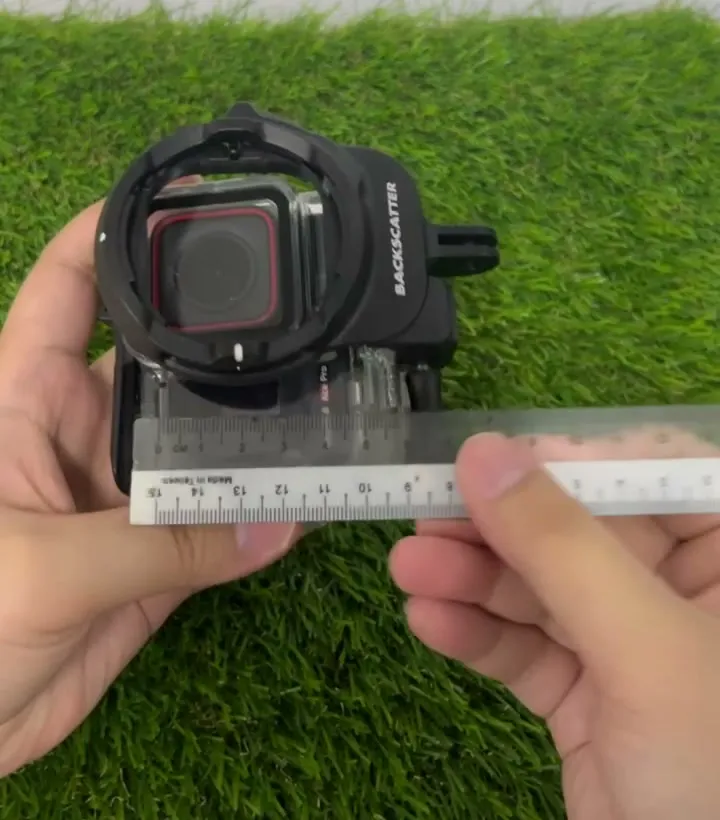 Measuring the customer's original mount on the dive housing with a steel ruler