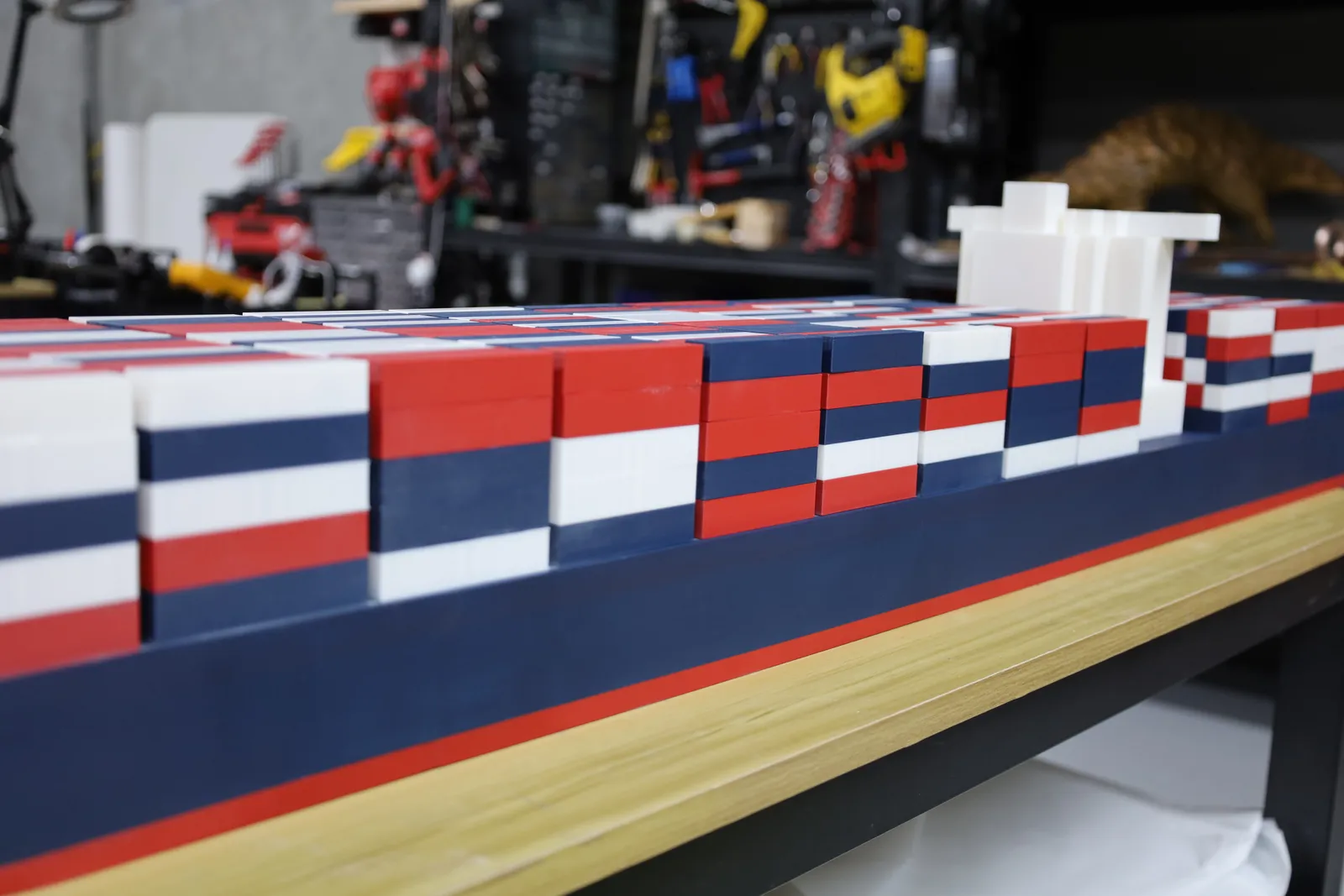 The length of the model side on, with the stacked containers running back towards the white bridge