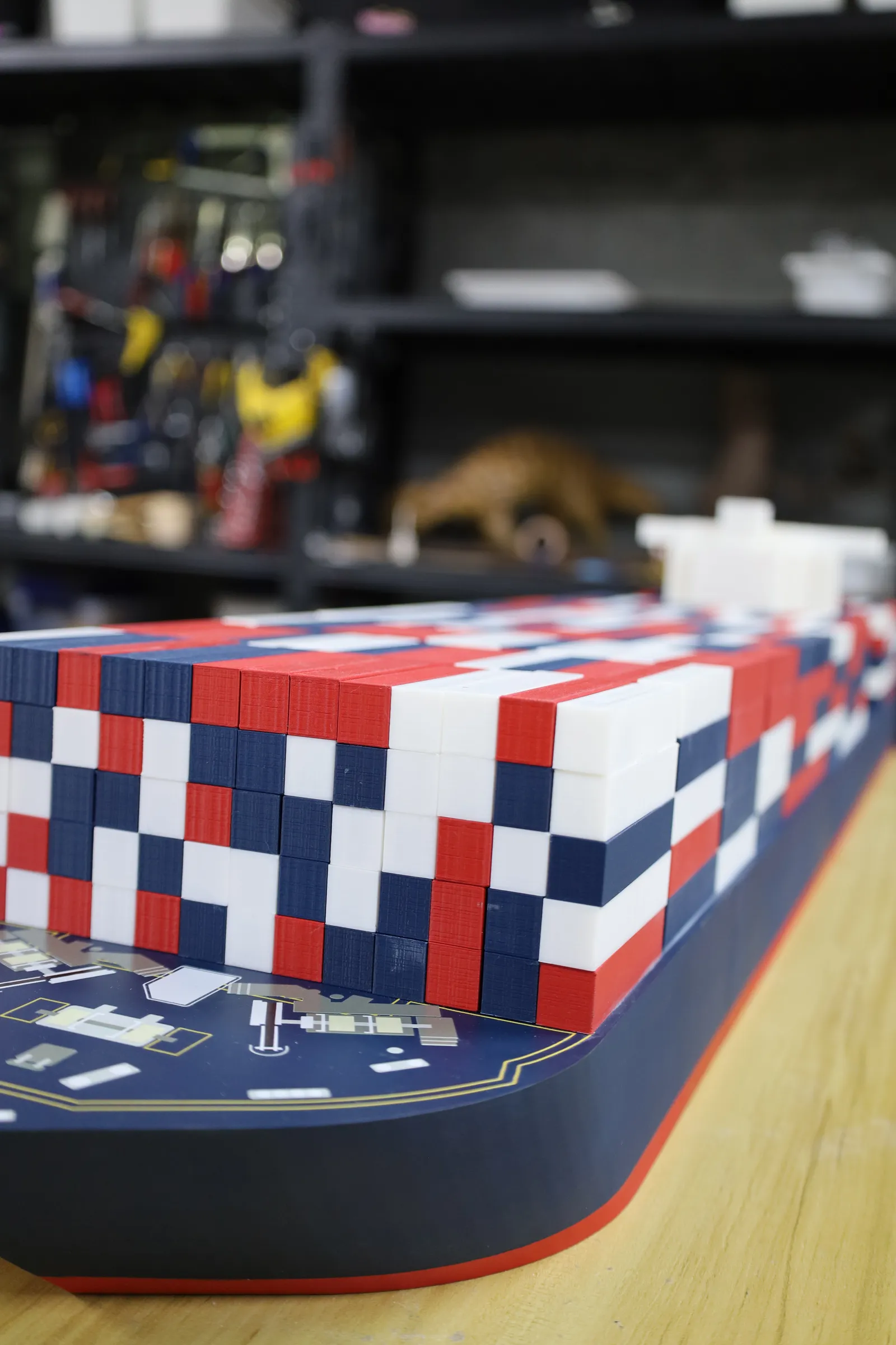 Looking along the model from the bow, with the deck fittings artwork on the foredeck in front of the container stacks