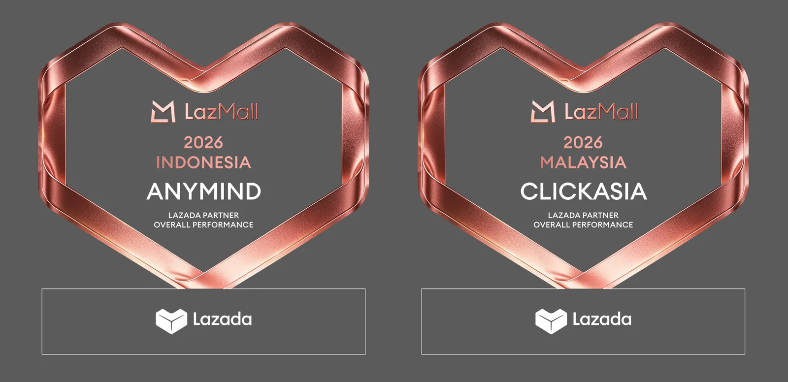 Render of two Design B awards reading LazMall 2026 Indonesia and Malaysia with each winner's name inside the heart, and the Lazada logo on the base