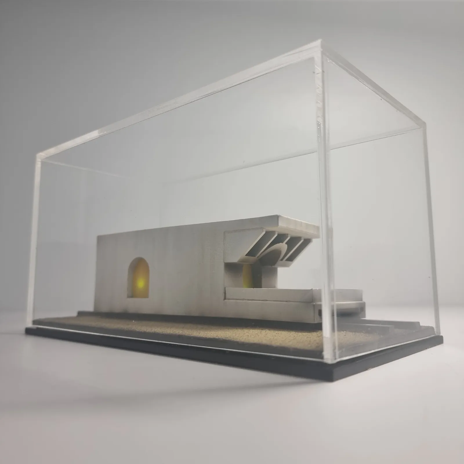 The model inside its clear protective case, seen at eye level
