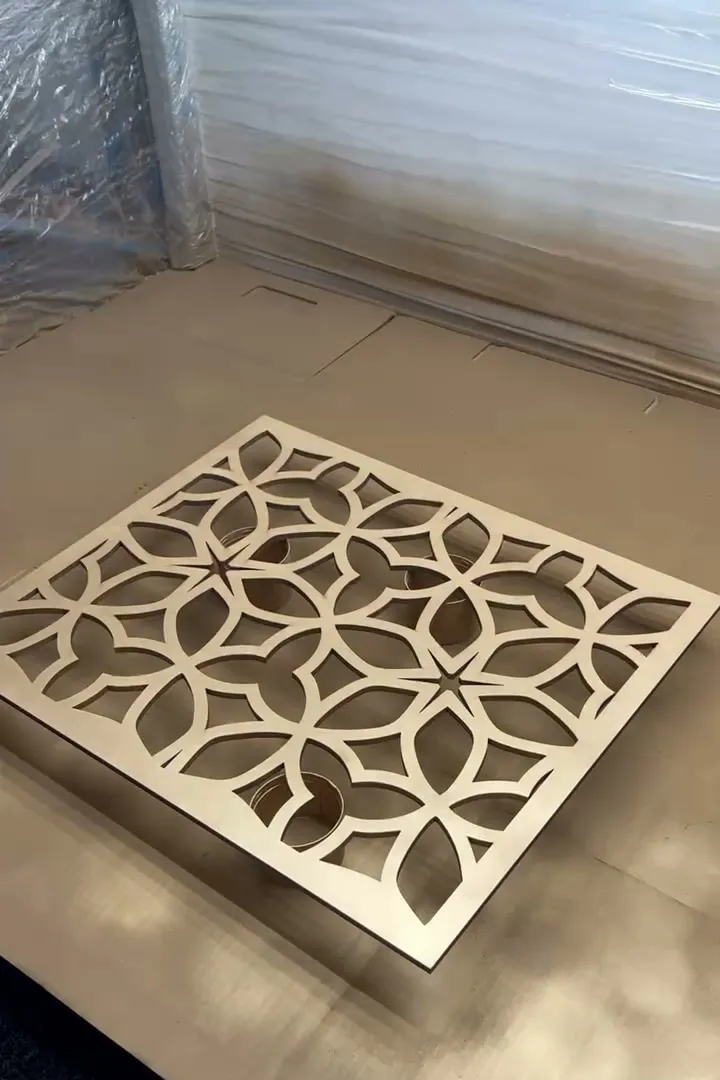 The finished petal pattern panel in gold, seen at an angle on the booth floor