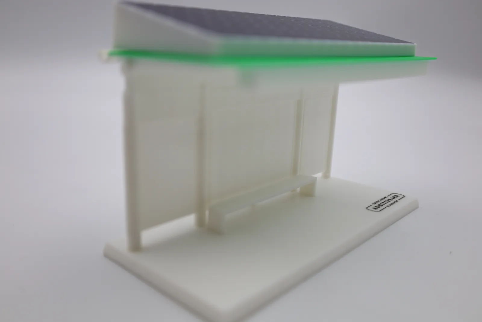The finished model from the left, showing the panelled back wall, the bench and the green roof edge