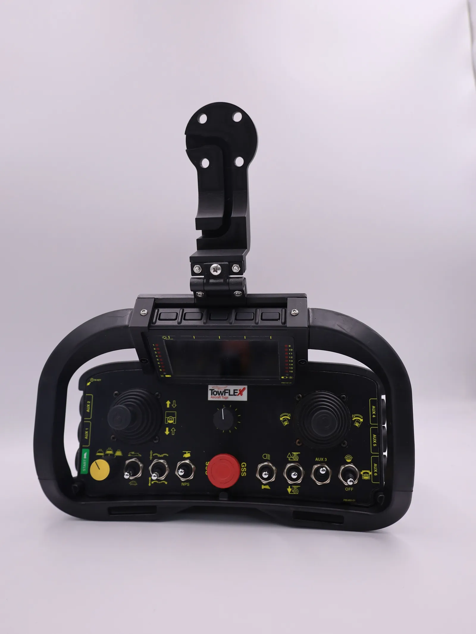 The finished mount from a slight angle on the controller, its arm folded on the hinge and the clamp gripping the screen housing
