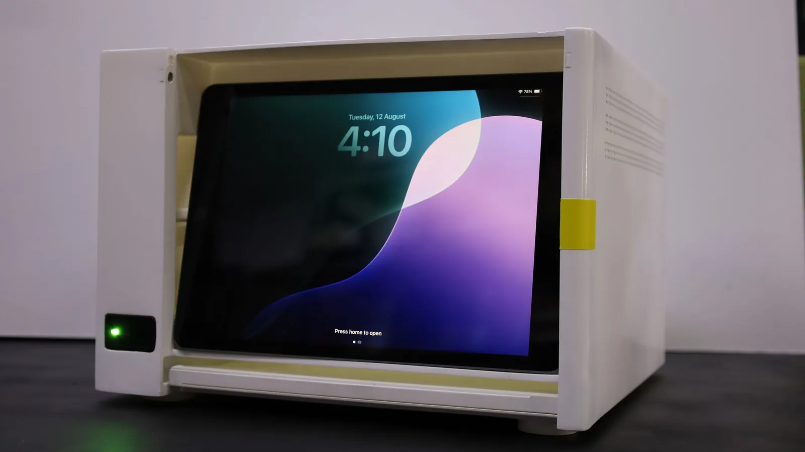 The Incucyte CX3 model with its front open, showing a lit screen inside the white body