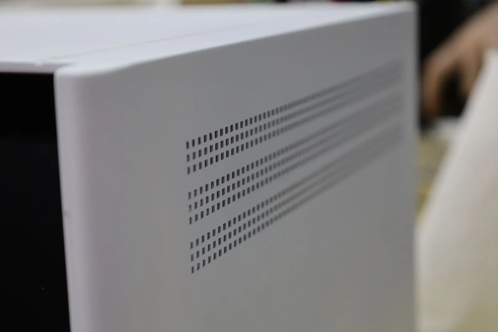 Rows of small vent slots along the white side of the Incucyte CX3 model