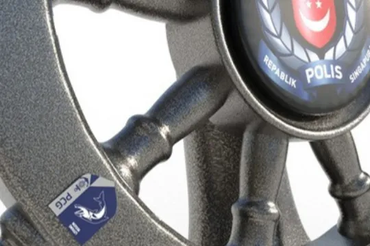 Close-up render of the first design's dark textured helm, with the police crest and a blue PCG unit badge printed on acrylic pieces