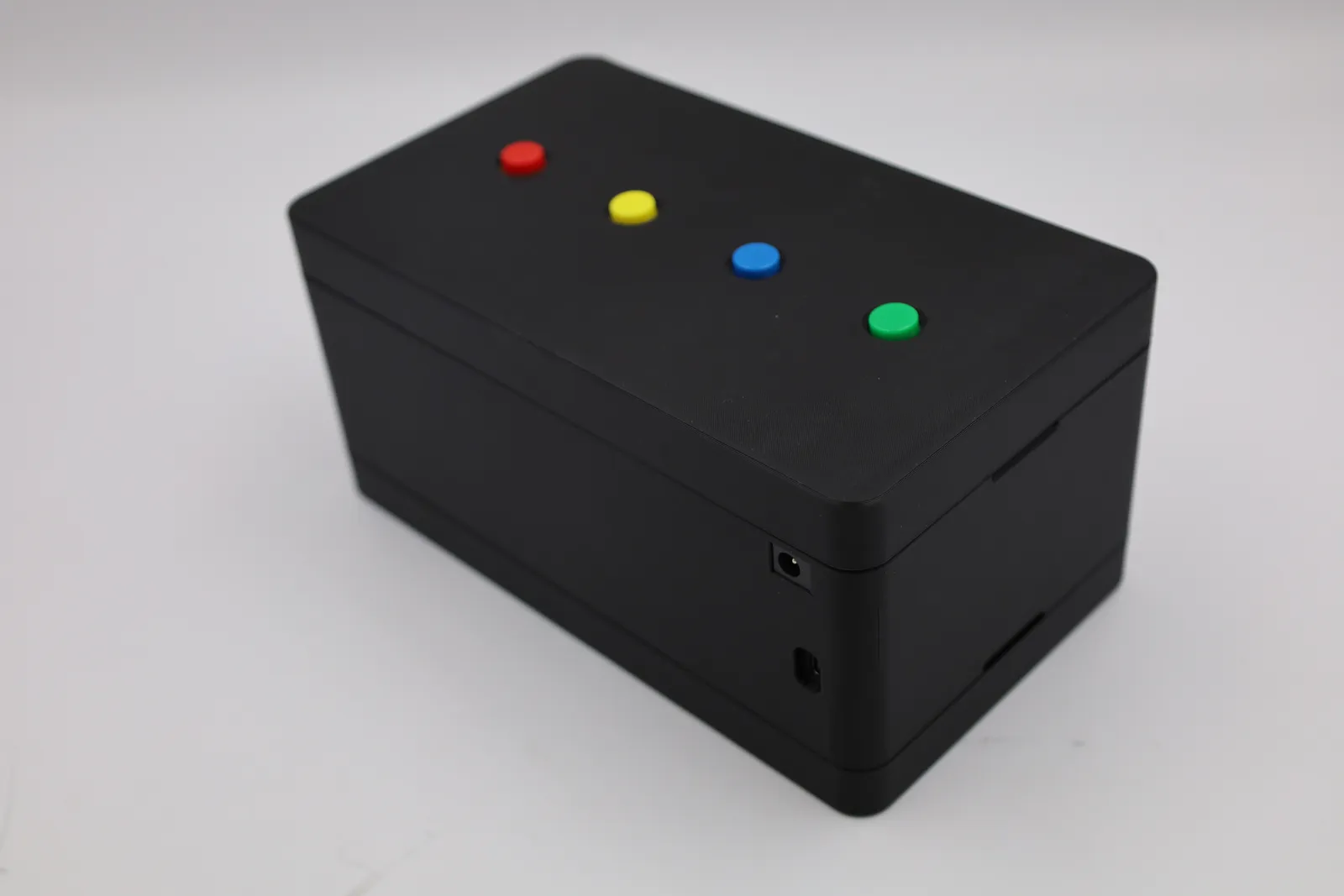 The assembled box from the end, showing the power socket and USB-C port and the joins between lid, body and base