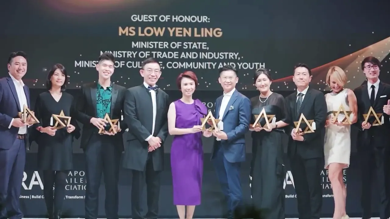 A row of winners on stage at the SRA Retail Awards gala dinner 2022, each holding a gold star