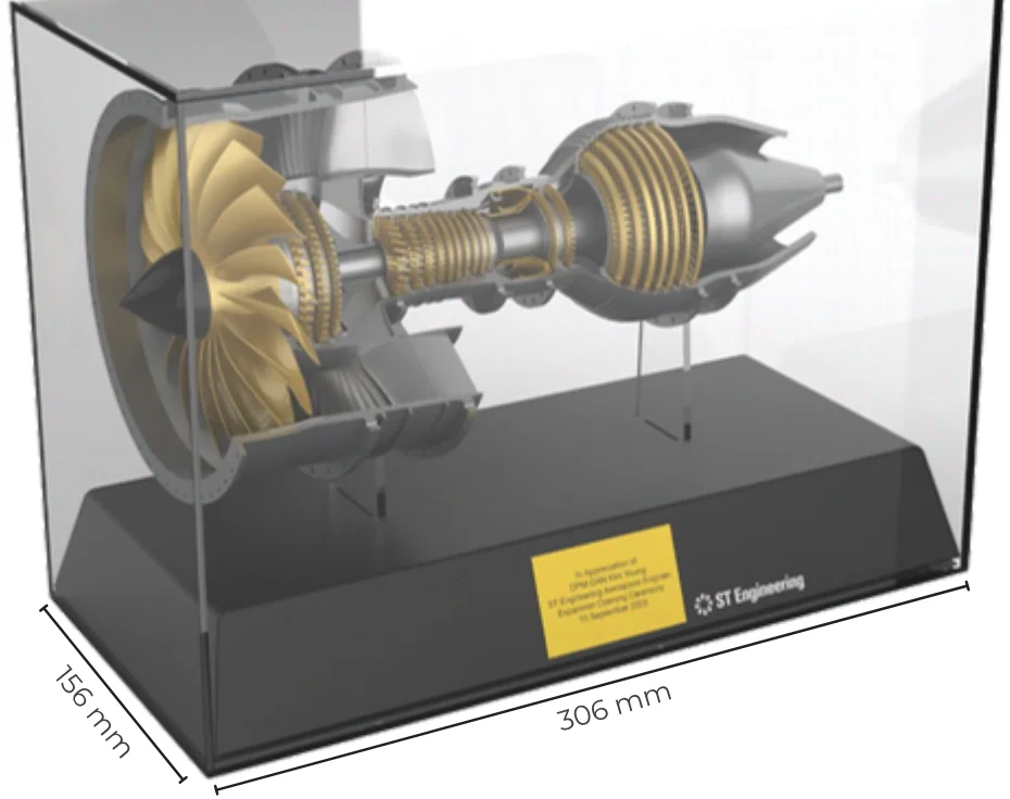 Render of the engine on its black base inside a clear acrylic case, marked 306 mm by 156 mm