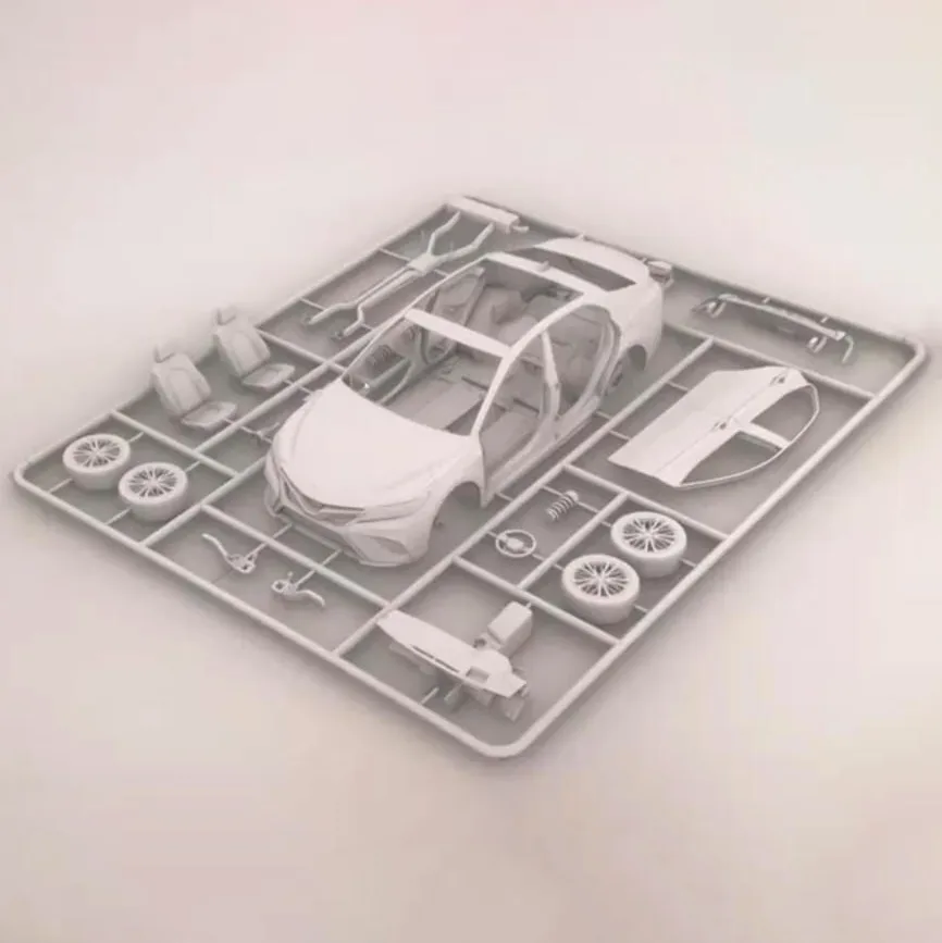 Render of one car kit lying flat: the car body, seats, wheels and doors on a grey frame
