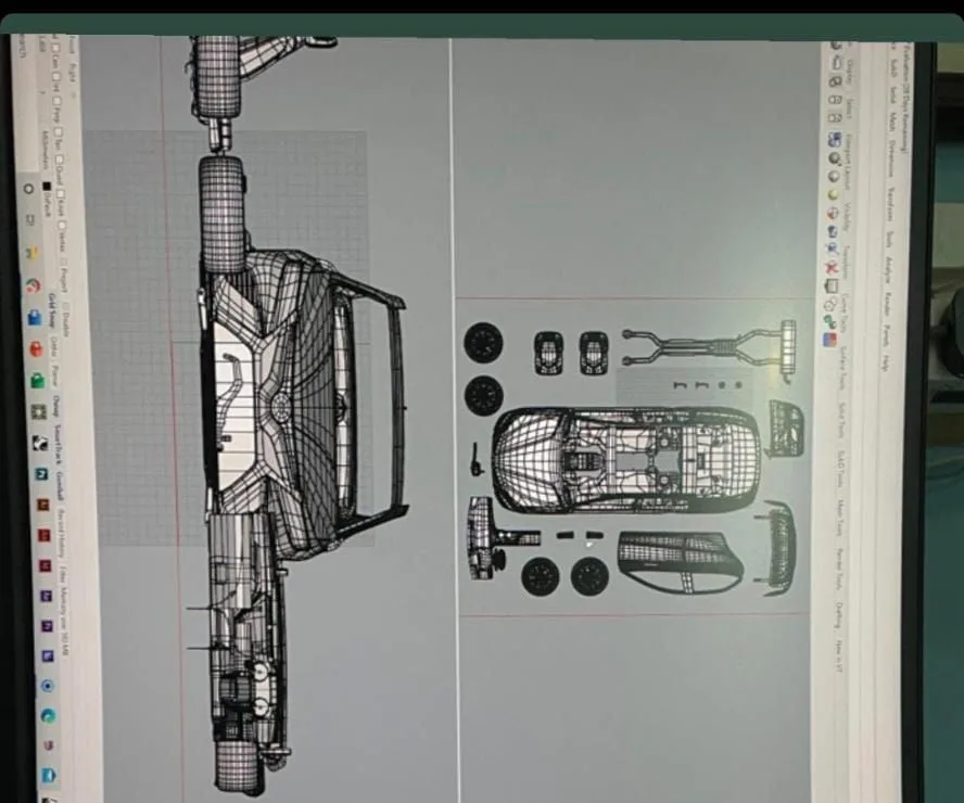 Screen showing a car's parts laid out in 3D: the body, chassis, wheels and seats