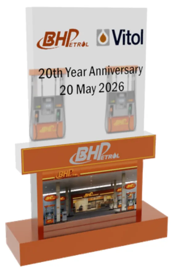 Render of the first design: an upright clear plaque printed with the BHPetrol and Vitol logos and 20th Year Anniversary, above a BHPetrol station front on an orange base