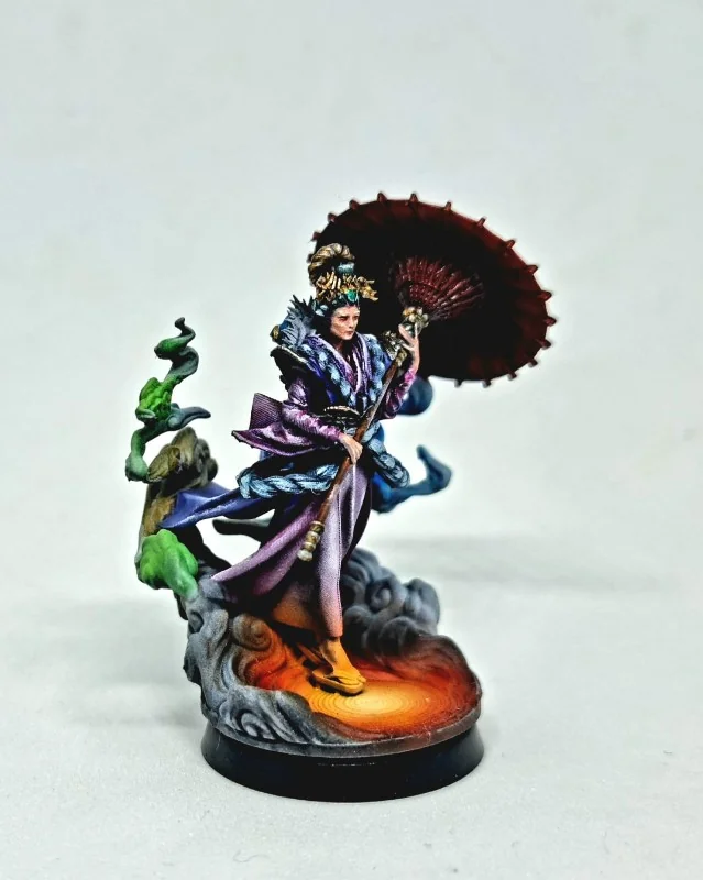 Hand-painted figurine of a kimono-clad figure holding a parasol and staff, posed on a sculpted swirling cloud base