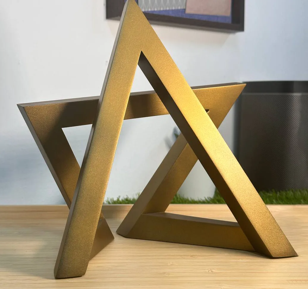 Gold interlocking triangle sculptural award