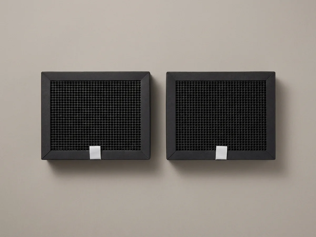 Two identical Bambu Lab activated carbon filter cartridges side by side