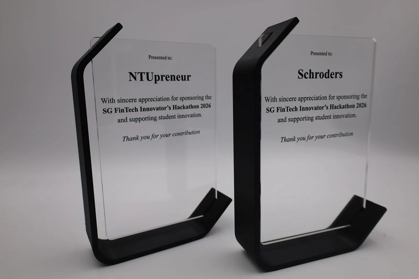 Two Arc plaques for the SG FinTech Innovator's Hackathon 2026