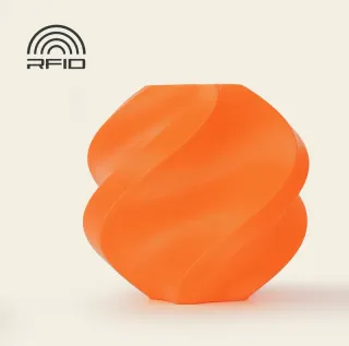 An orange swirled vase 3D printed in ABS